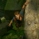 Nathan Drake hangs onto a ledge trying to remember how many PS Plus subs he stacked.
